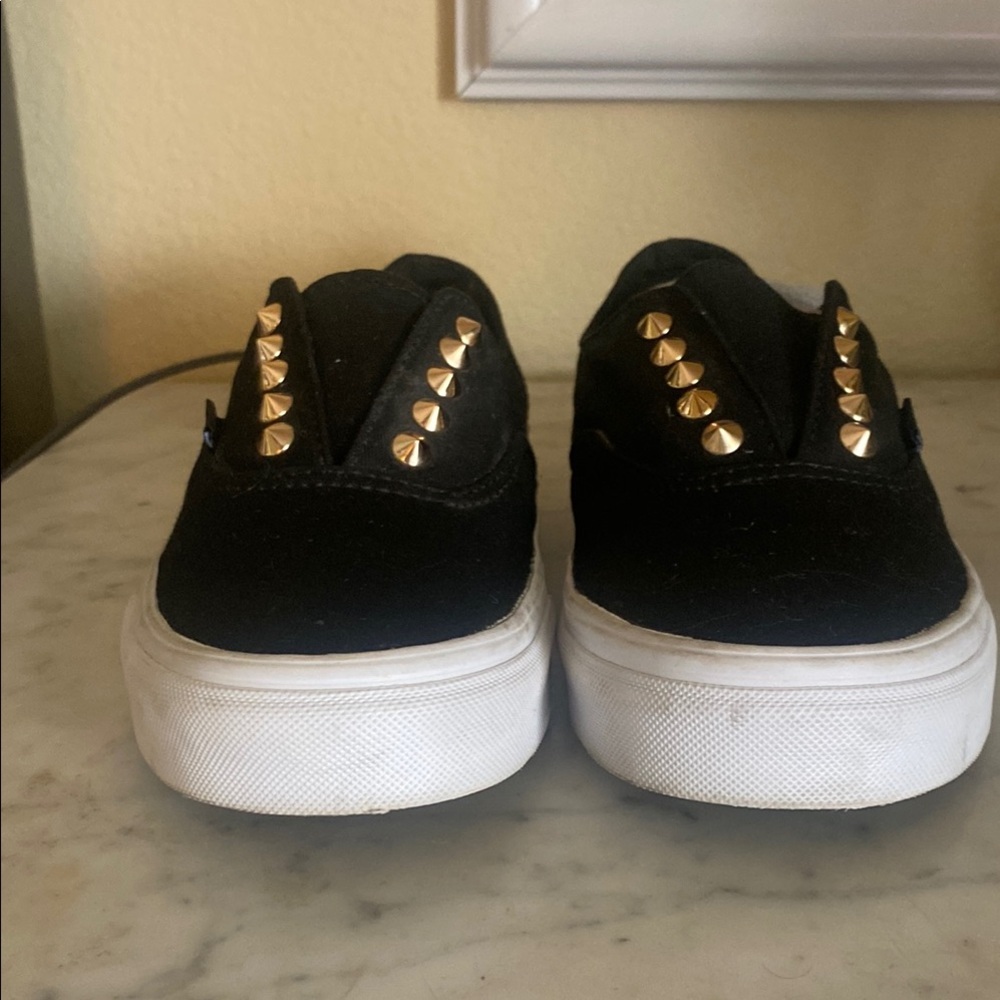 Vans | Black Slip Ons with Gold Studs.